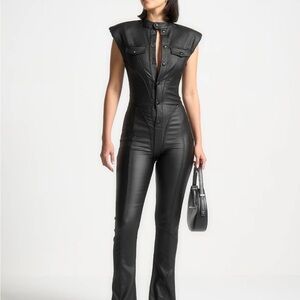 Maniere De Voir Annette
in Black
Wax Coated Denim Jumpsuit SOLD OUT ONLINE